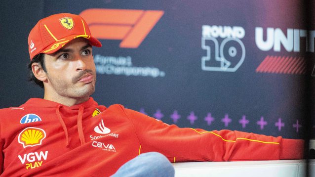 Carlos Sainz sitting in the FIA press conference