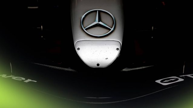 A close-up detail shot of the Mercedes W15 nose and front wing