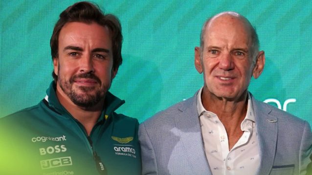 Fernando Alonso and Adrian Newey smile as they stand arm in arm for the cameras