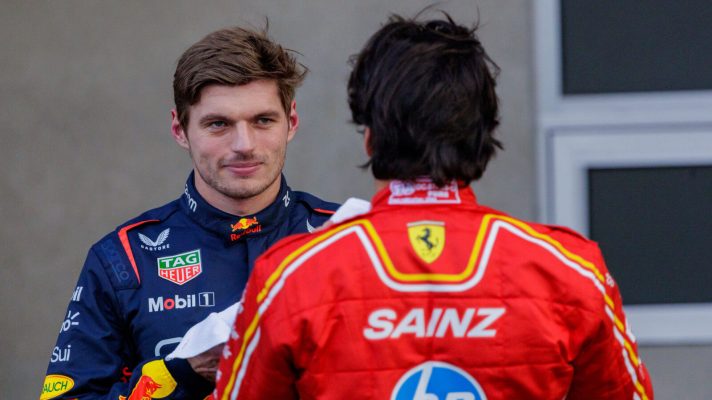 Max Verstappen speaking with Carlos Sainz