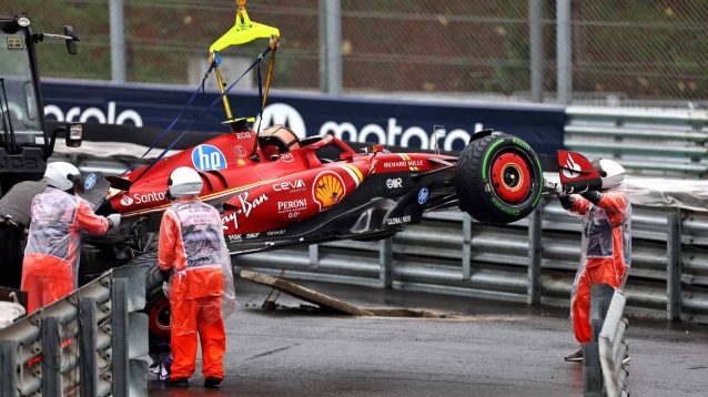 Carlos Sainz has his car lifted away.