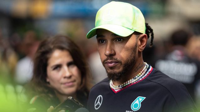 Lewis Hamilton looks annoyed in the paddock in Brazil