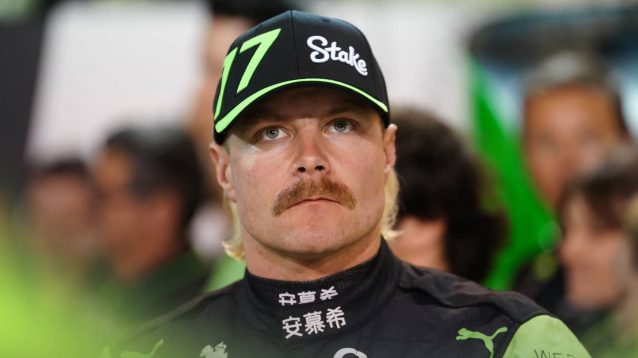 Valtteri Bottas looks darkly from underneath the peak of his cap
