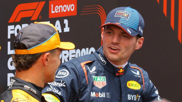 Max Verstappen smiling at Lando Norris