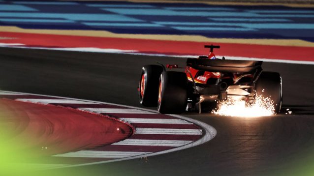 A rear-facing shot of Charles Leclerc's Ferrari kicking up a shower of sparks in Qatar