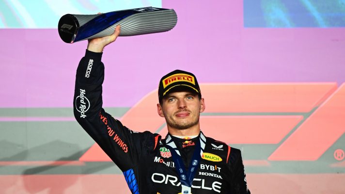 Max Verstappen lifts a trophy