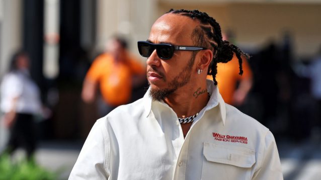 Lewis Hamilton arrives in the paddock