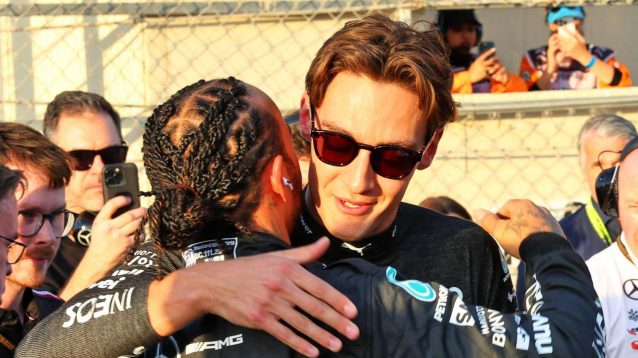 Lewis Hamilton and George Russell embrace in Abu Dhabi.