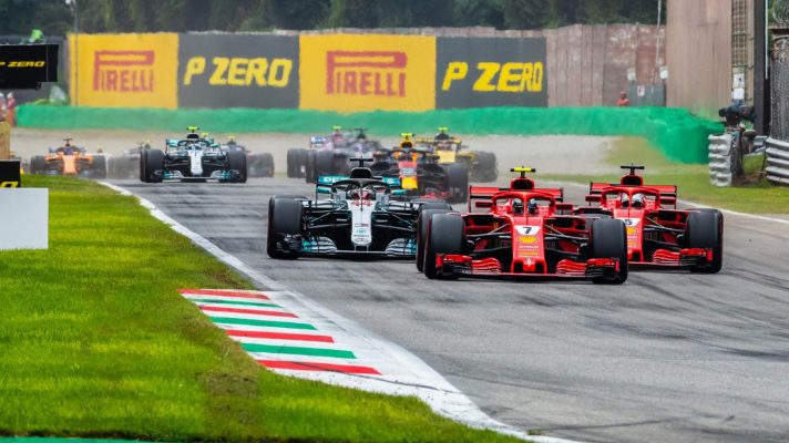 Ferrari's Kimi Raikkonen and Sebastian Vettel battle Mercedes' Lewis Hamilton at the 2018 Italian Grand Prix.