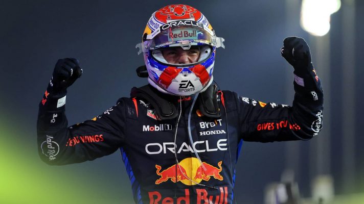 Max Verstappen raises his arms in celebration after winning in Bahrain