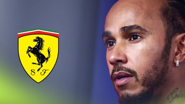 A close-up shot of Lewis Hamilton looking surprised with a prominent Ferrari logo alongside him