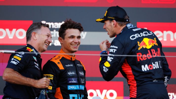 Christian Horner, Lando Norris and Max Verstappen smile on the podium