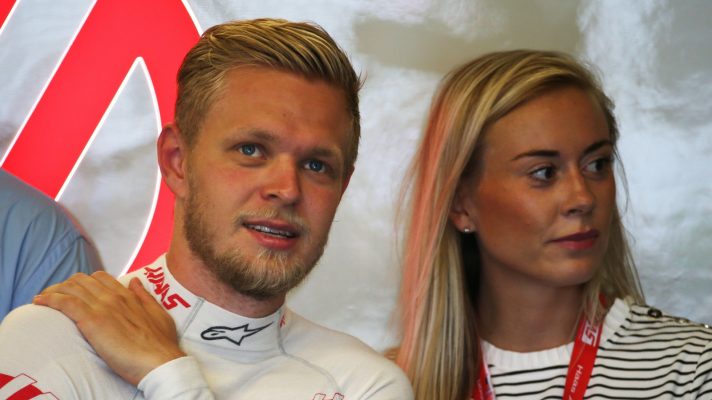 Kevin and Louise Magnussen in the Haas garage.