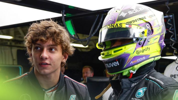 Andrea Kimi Antonelli stands alongside a race-ready Lewis Hamilton in the Mercedes garage