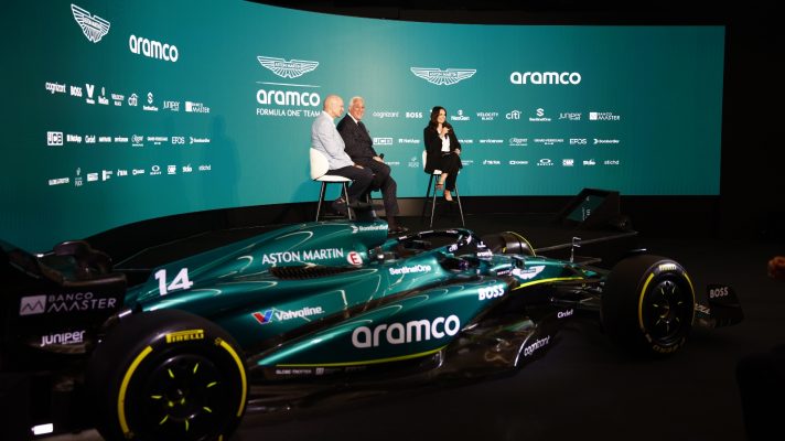 Adrian Newey and Lawrence Stroll, Owner, Aston Martin F1 Team, on stage with Laura Winter