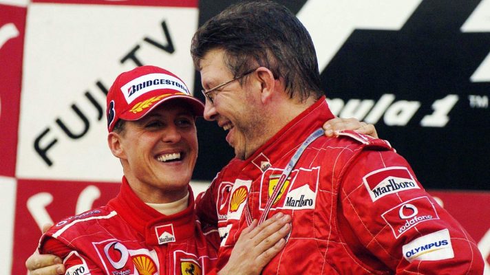 Ferrari's Michael Schumacher and Ross Brawn on the podium at the 2004 Japanese Grand Prix.