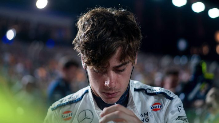 Franco Colapinto lowers his head on the grid in Singapore