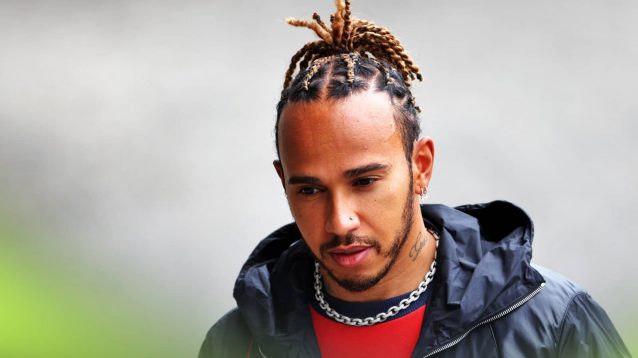 Lewis Hamilton wearing red clothing