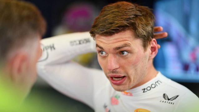 Max Verstappen in animated conversation in the Red Bull garage