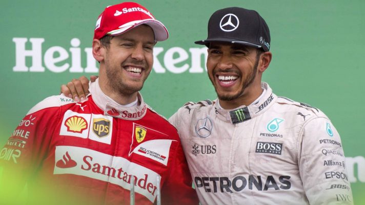 Sebastian Vettel and Lewis Hamilton laughing on the podium