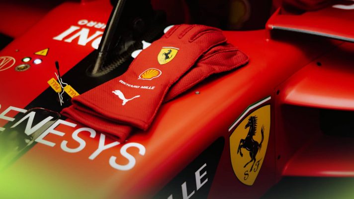 Lewis Hamilton's gloves rest on the monocoque of the Ferrari SF-23