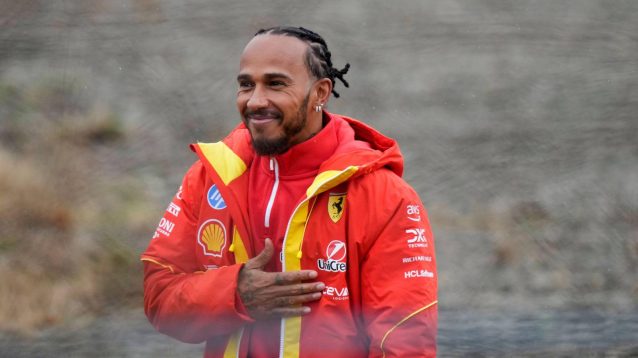 F1 news: Lewis Hamilton with his hand across his chest at Fiorano.