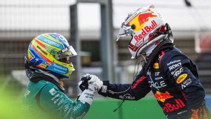 Fernando Alonso and Max Verstappen greet each other after finishing on the podium at the 2023 Dutch Grand Prix