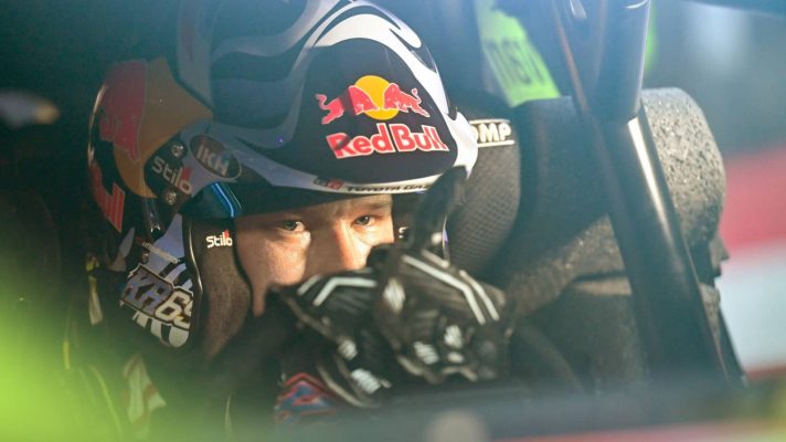 Kalle Rovanpera's eyes are visible through the windscreen of his Toyota WRC car