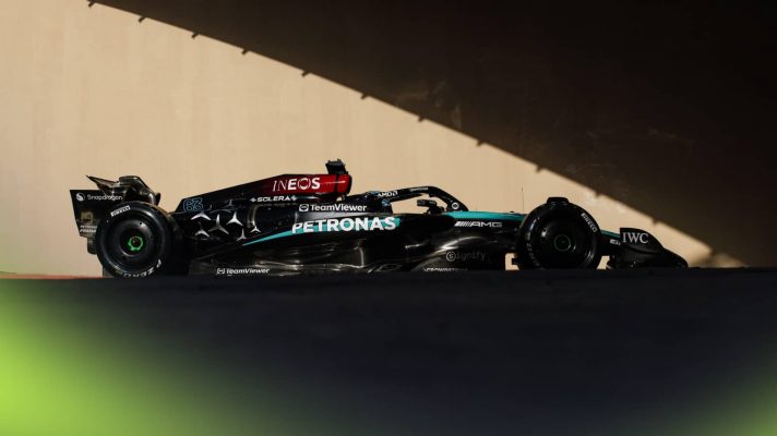 George Russell's Mercedes entering the tunnel in Abu Dhabi with a dramatic shadow effect