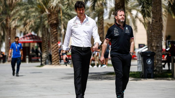 Mercedes' Toto Wolff walks with chief communications officer Bradled Lord at the 2022 Bahrain Grand Prix.