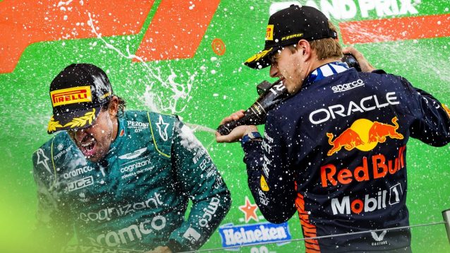 Fernando Alonso and Max Verstappen spray champagne on the podium