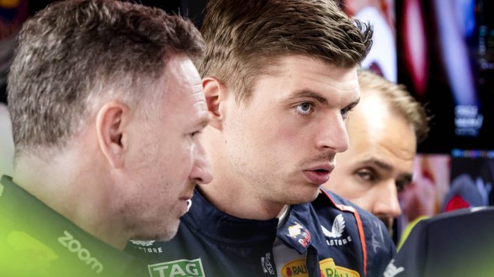 Max Verstappen and Christian Horner look concerned in the Red Bull garage