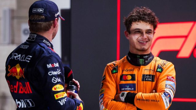 Lando Norris smiles in conversation with Max Verstappen at the 2024 Qatar Grand Prix