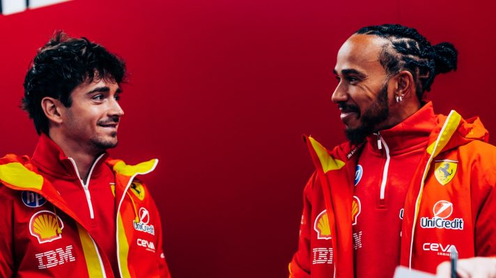 Charles Leclerc looks at Lewis Hamilton