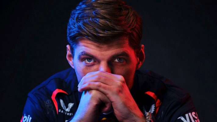 Max Verstappen, Red Bull, poses, with his hands in front of his face, at the F1 75 season launch event in London