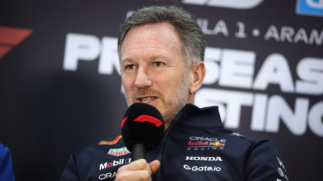 Red Bull CEO Christian Horner speaking into a microphone.
