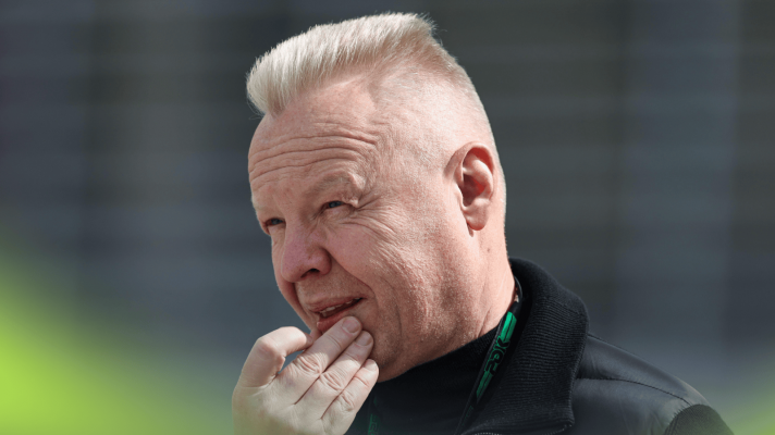 Dmitry Mazepin touches his face in the F1 paddock in Bahrain