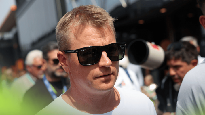 Kimi Raikkonen wears sunglasses in the paddock at Monza in 2024