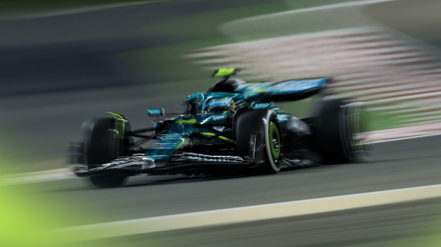 A blurry action shot of Fernando Alonso on track in Bahrain