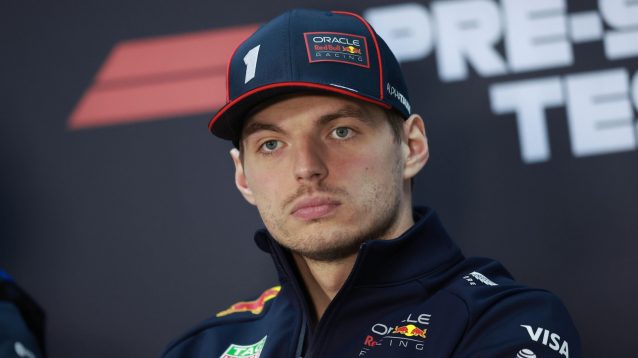 Red Bull's Max Verstappen looking serious at a press conference during 2025 Bahrain testing