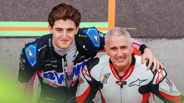 Jack Doohan and Mick Doohan pose together in the F1 pit lane