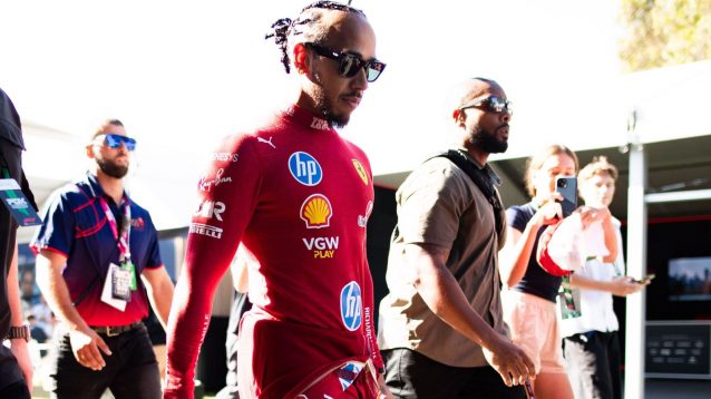 Lewis Hamilton, Ferrari, walking through the paddock at the 2025 Australian Grand Prix