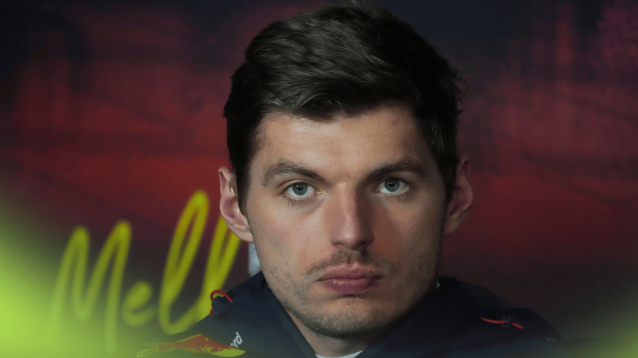 Max Verstappen looks stern in a press conference
