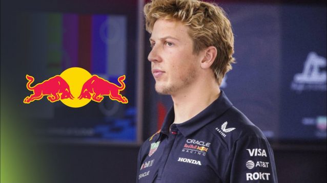 Liam Lawson alone in the Red Bull garage, with a Red Bull logo placed on the left