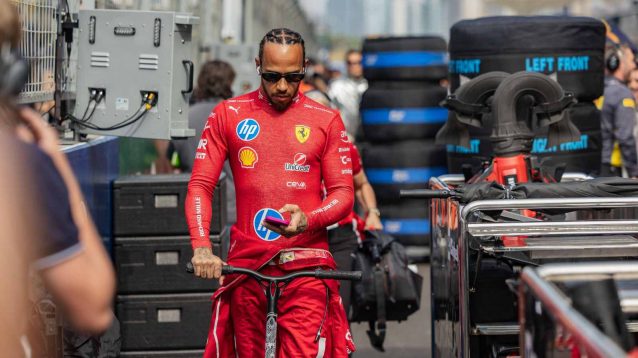Lewis Hamilton, Ferrari, walks through the paddock.