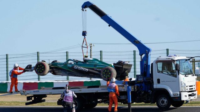 Fernando Alonso has his car recovered in practice.