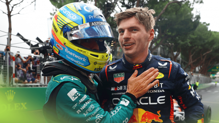 Fernando Alonso pats Max Verstappen on the chest in congratulations at the 2023 Monaco Grand Prix