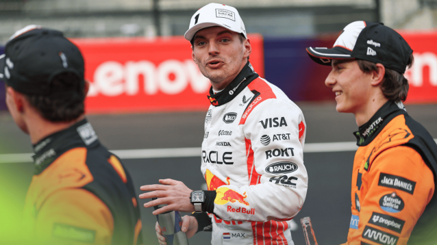 Max Verstappen is framed by Lando Norris and Oscar Piastri on the grid after qualifying in Japan