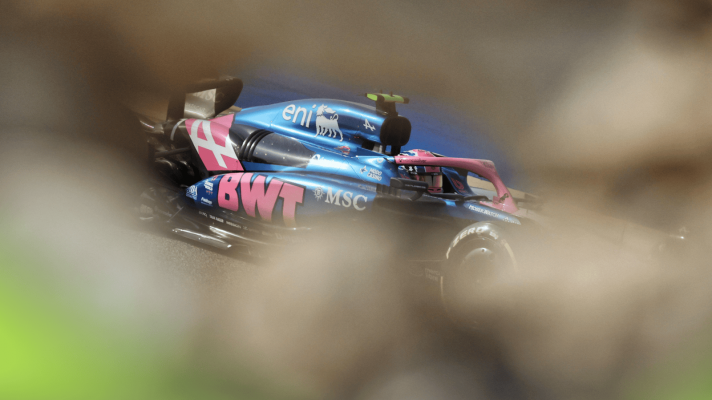 Jack Doohan's Alpine visible through the scenery during practice in Bahrain