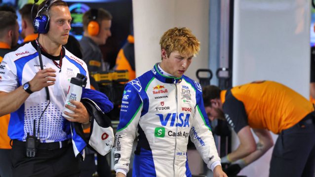 Liam Lawson walking down the pit lane after another Q1 exit